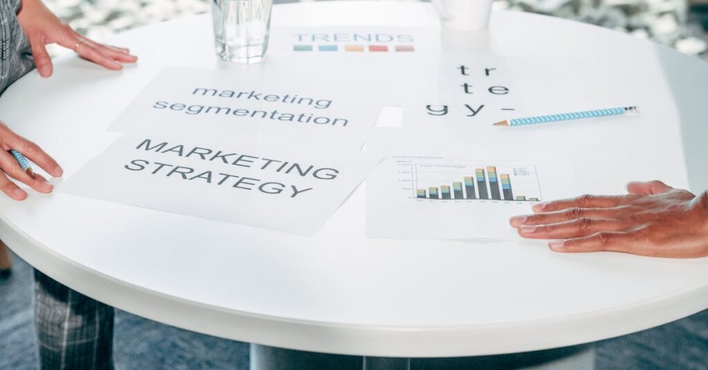 Two professionals collaborate on marketing strategy and segmentation at a round table.