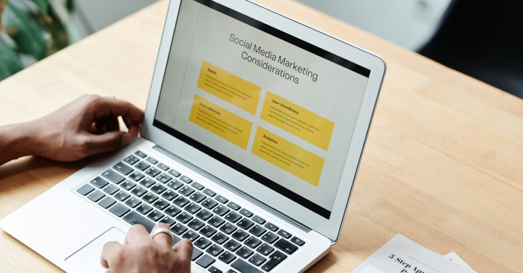 A person using a laptop to review social media marketing strategies at home.